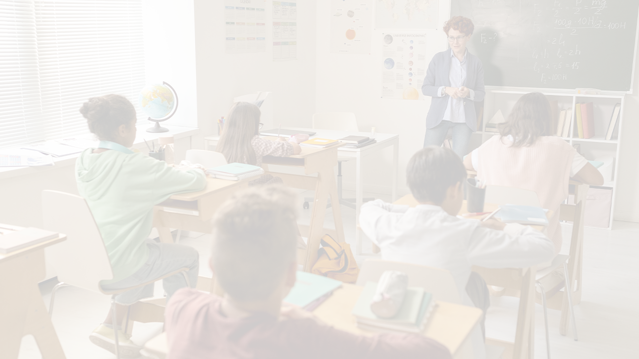 Kids sitting in a classroom, listening to a teacher