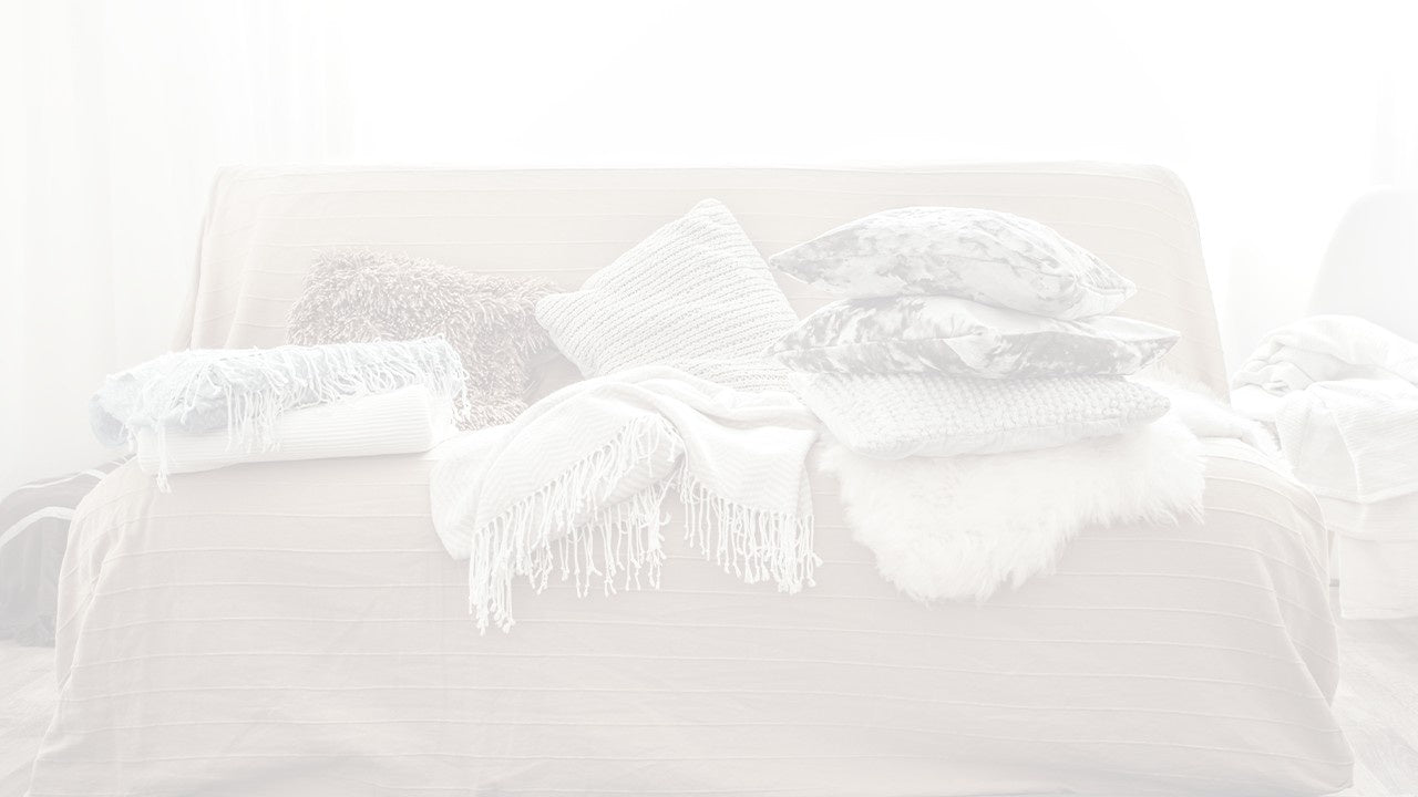 A bunch of fabris on a couch