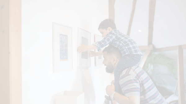 Several framed photos hanging on a wall