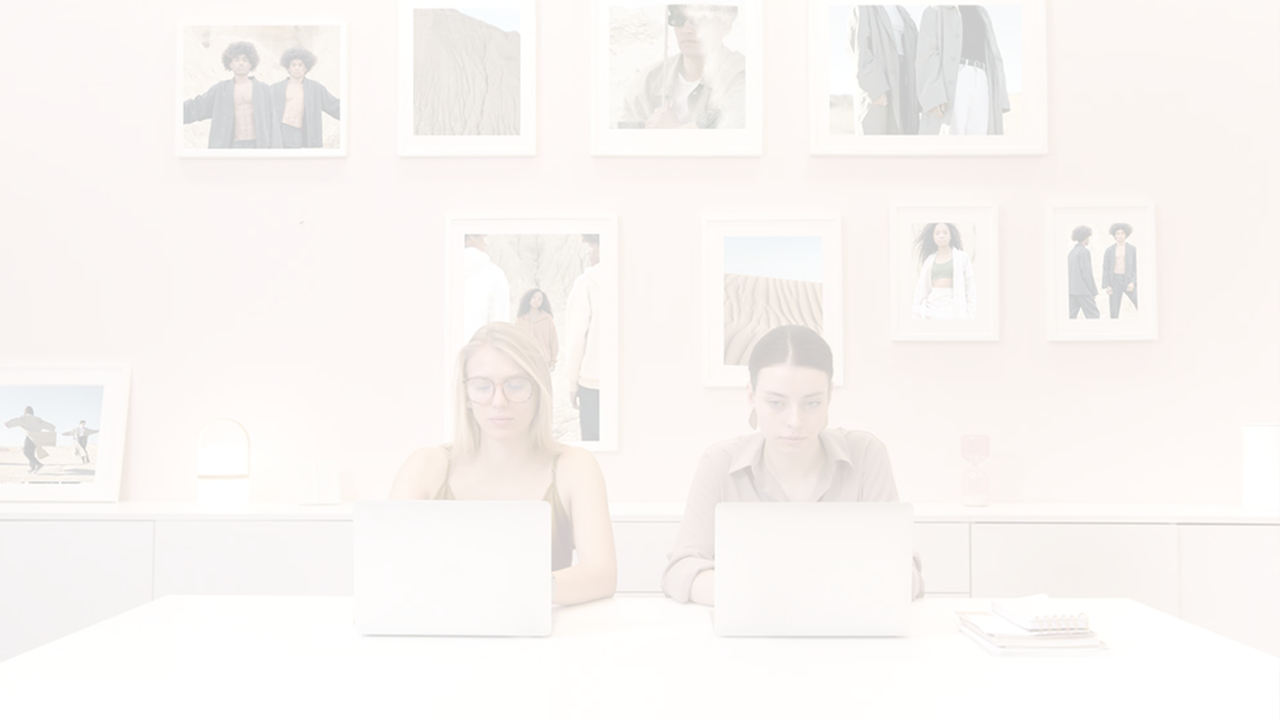 Darkened image of an office with a picture on the wall