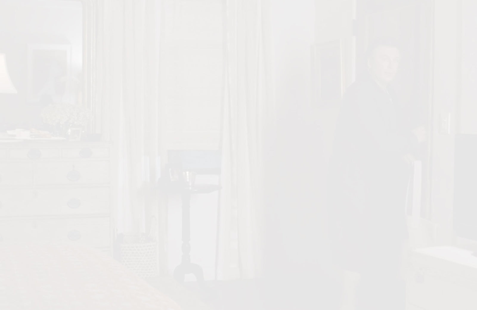 whitened still from the movie 'it's complicated' showing wall art reflected on a mirror above a dresser