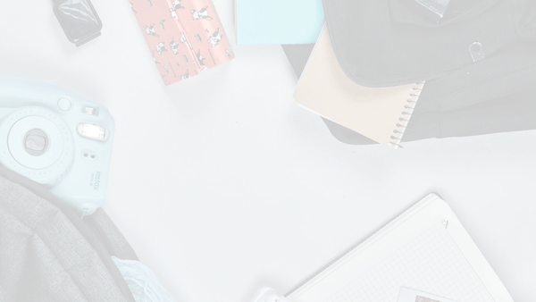 Darkened image of a person hanging art on the wall