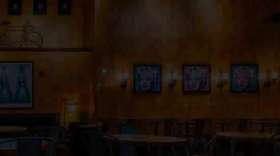 Darkened image of a room with retro art