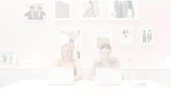 Darkened image of an office with a picture on the wall