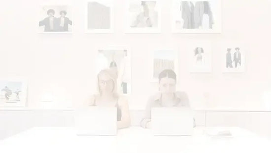 Darkened image of an office with a picture on the wall