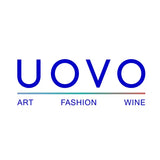 Blue ’uovo’ logo with the words art, fashion, and wine beneath it.
