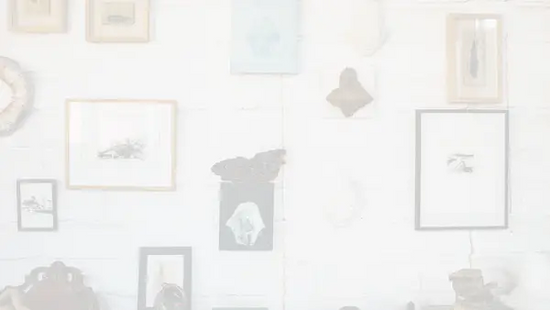 A faded image of a closeup of a gallery wall